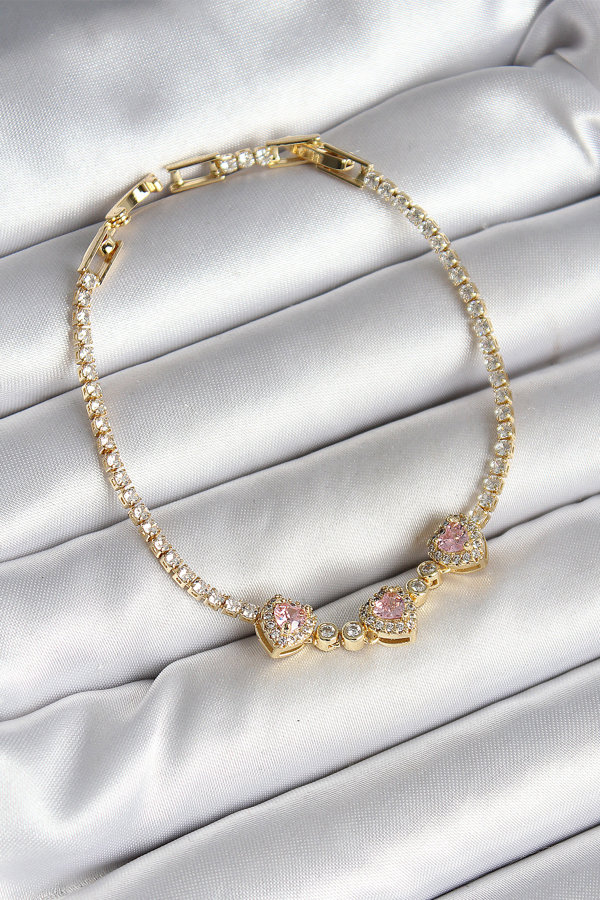 Pirinç Sıralı Pembe Kalp Figürlü Zirkon Taşlı Gold Renk Kadın Bileklik